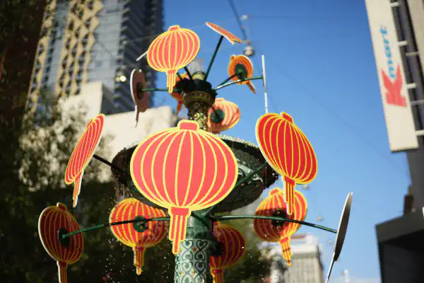 Stylised chinese lantern decorations, close up, mounted on top of a fountain