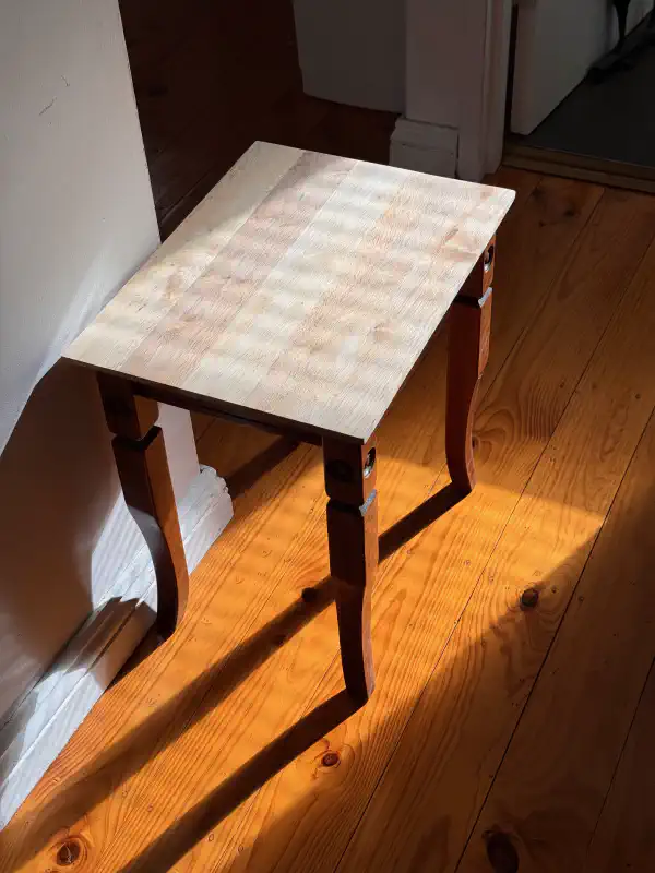 Table standing on a wood floor in the sunlight