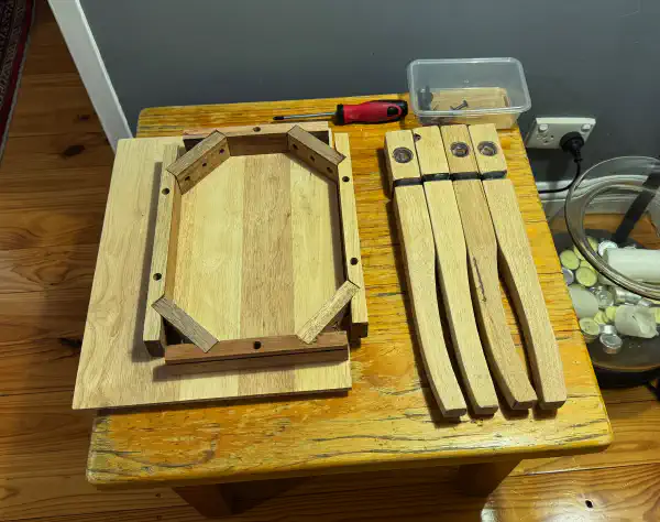 all the parts that make up a table, but not assembled