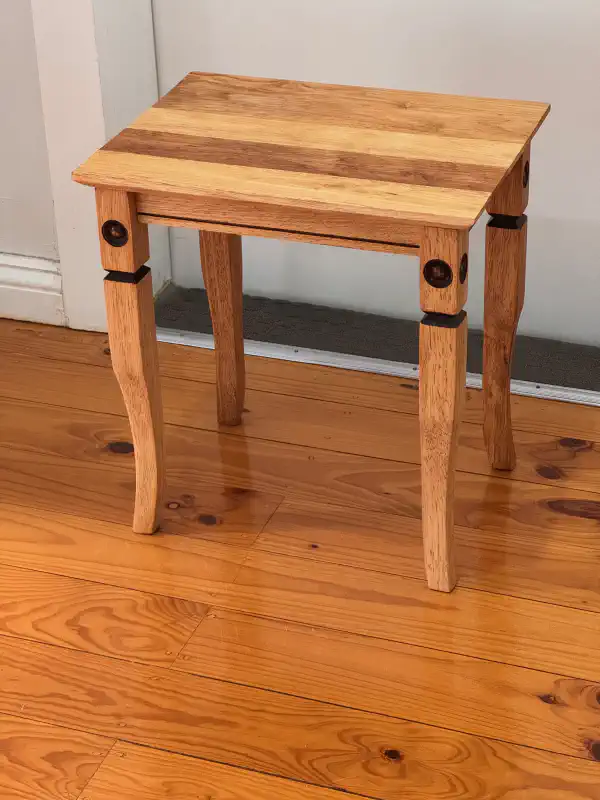 small table, standing against a wall
