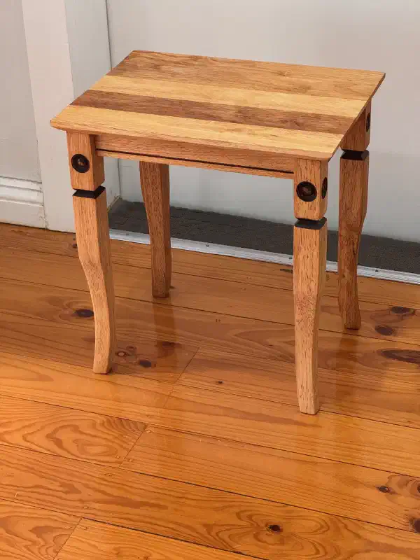 small table, standing against a wall
